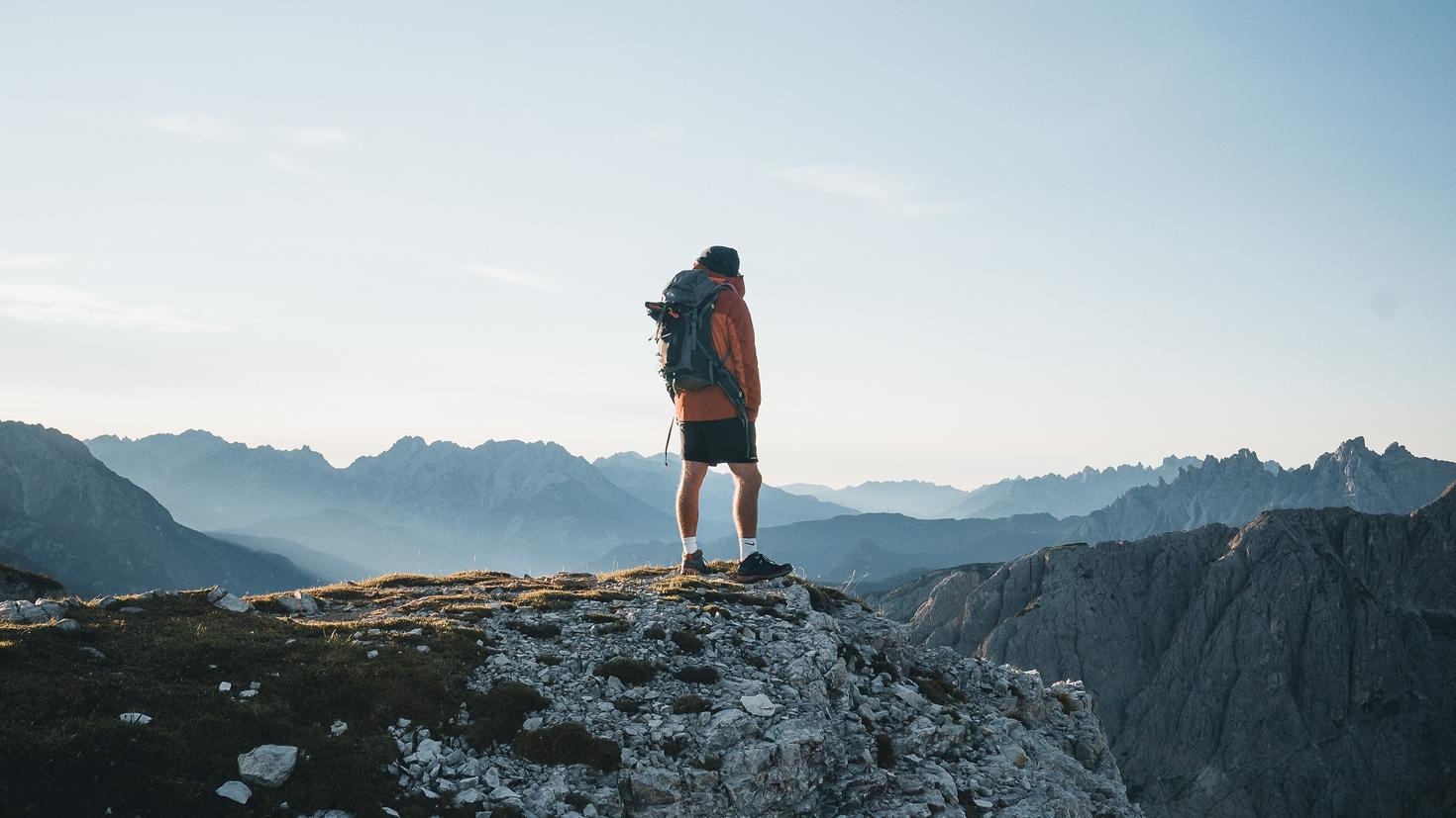 Student at the top of a mountain on a field trip