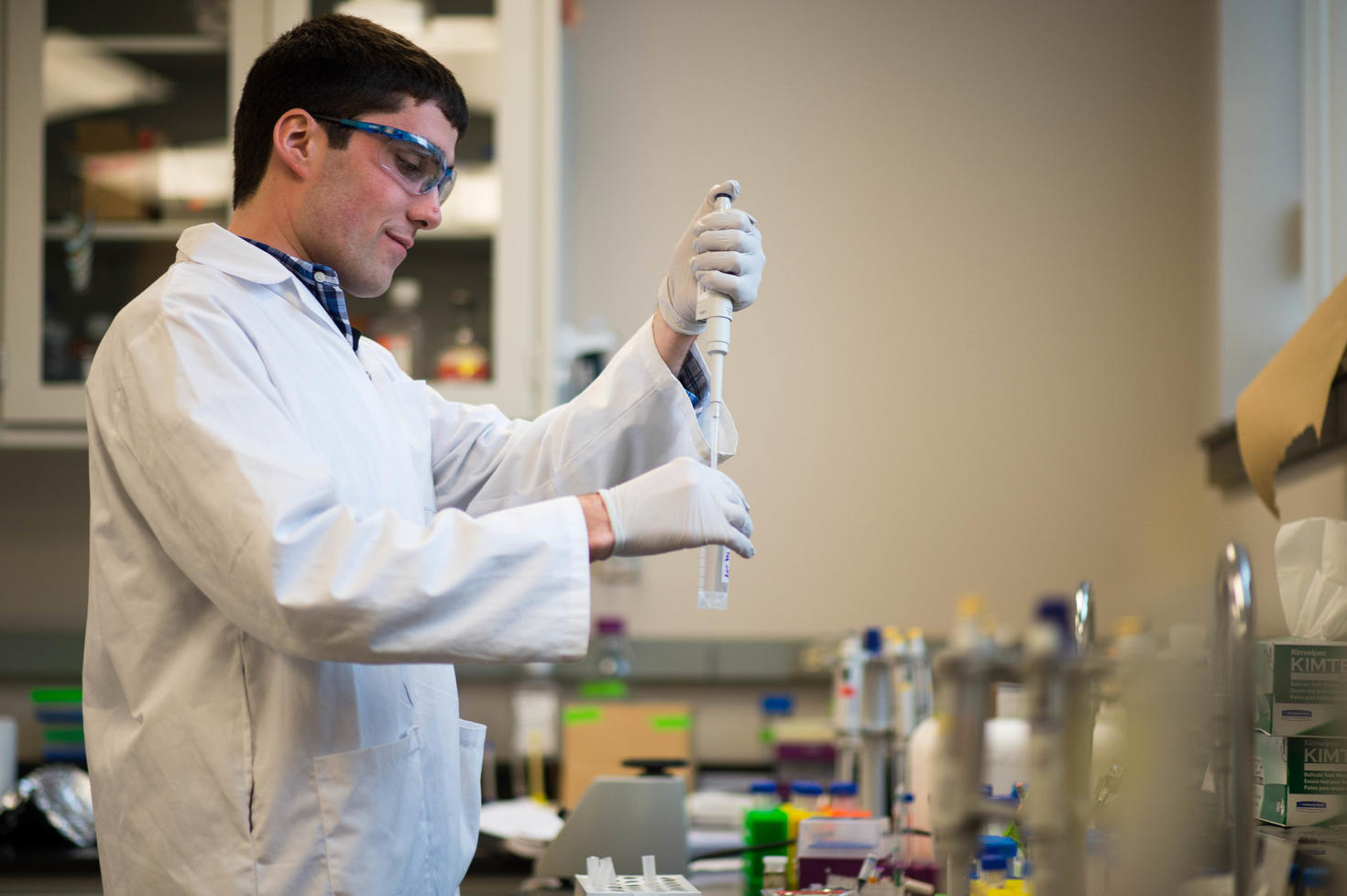 Graduate student working with samples