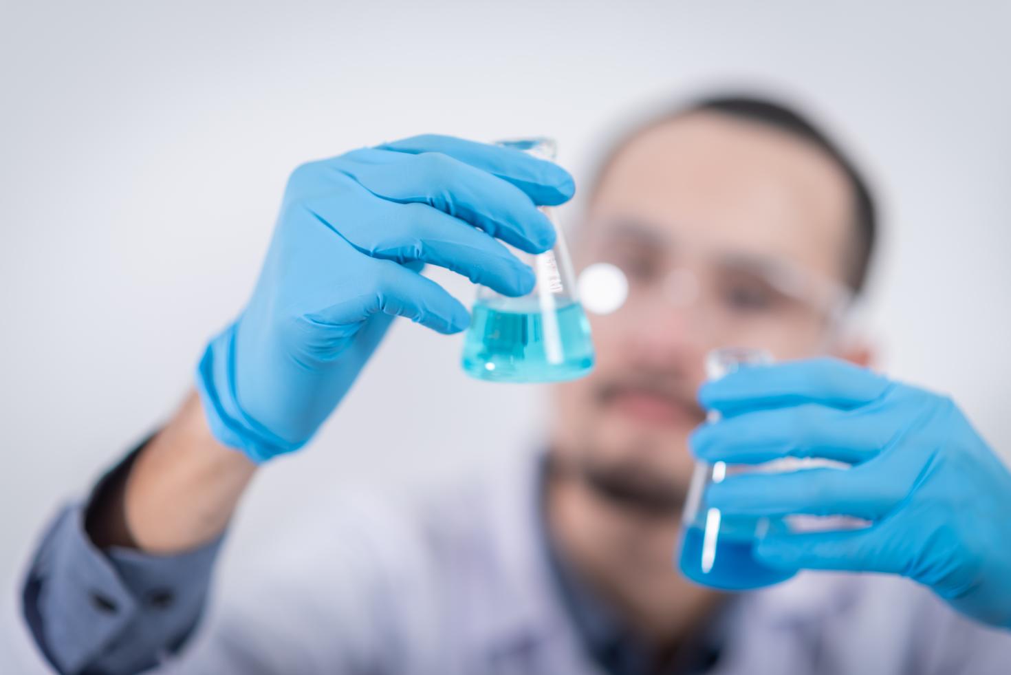 A researcher looking at liquid samples