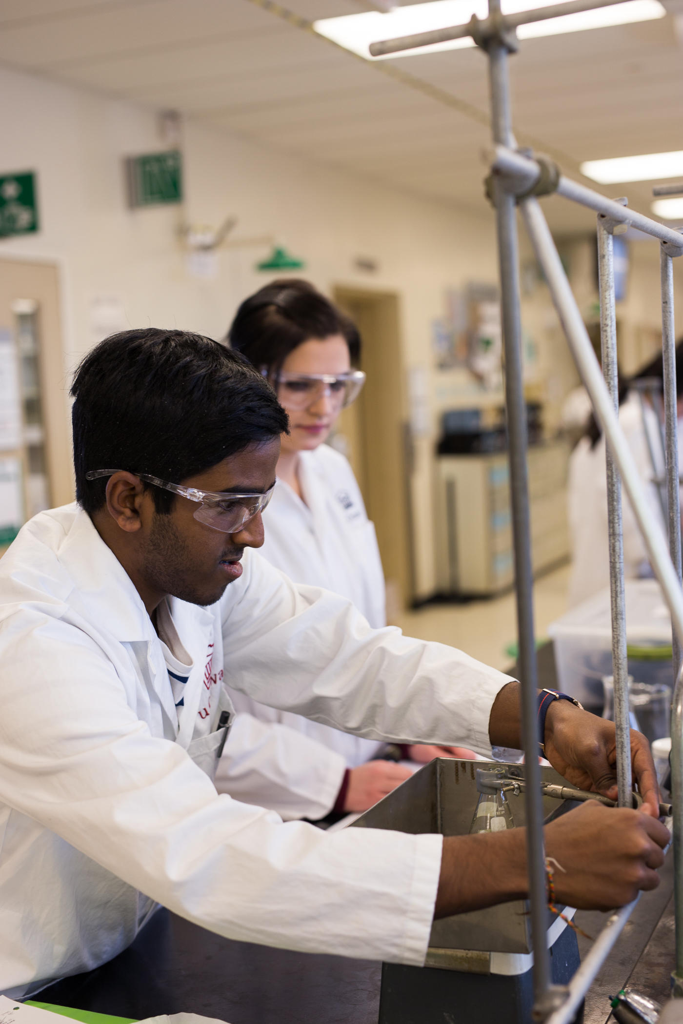 Two students working in a chemistry lab