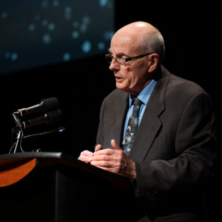 Barry McLeod speaking at the ceremony of excellence