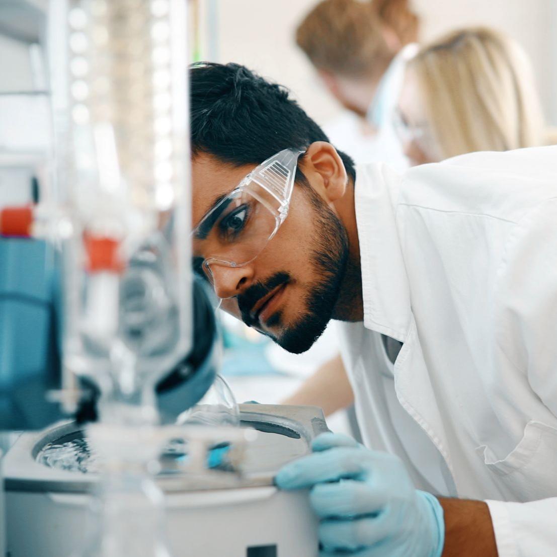 Male student working in laboratory 