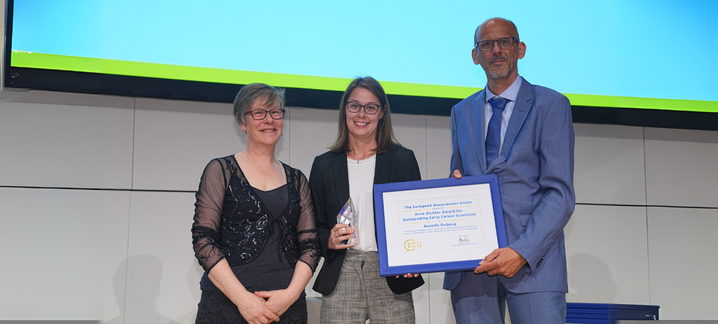 Renelle Dubosq receiving an award on stage