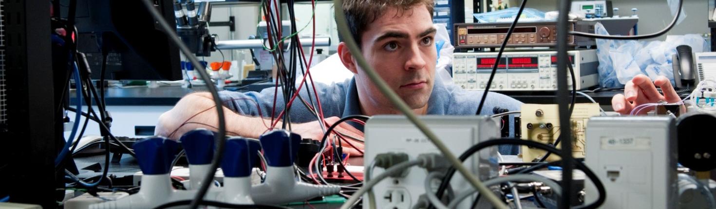 Student in a research physics lab.
