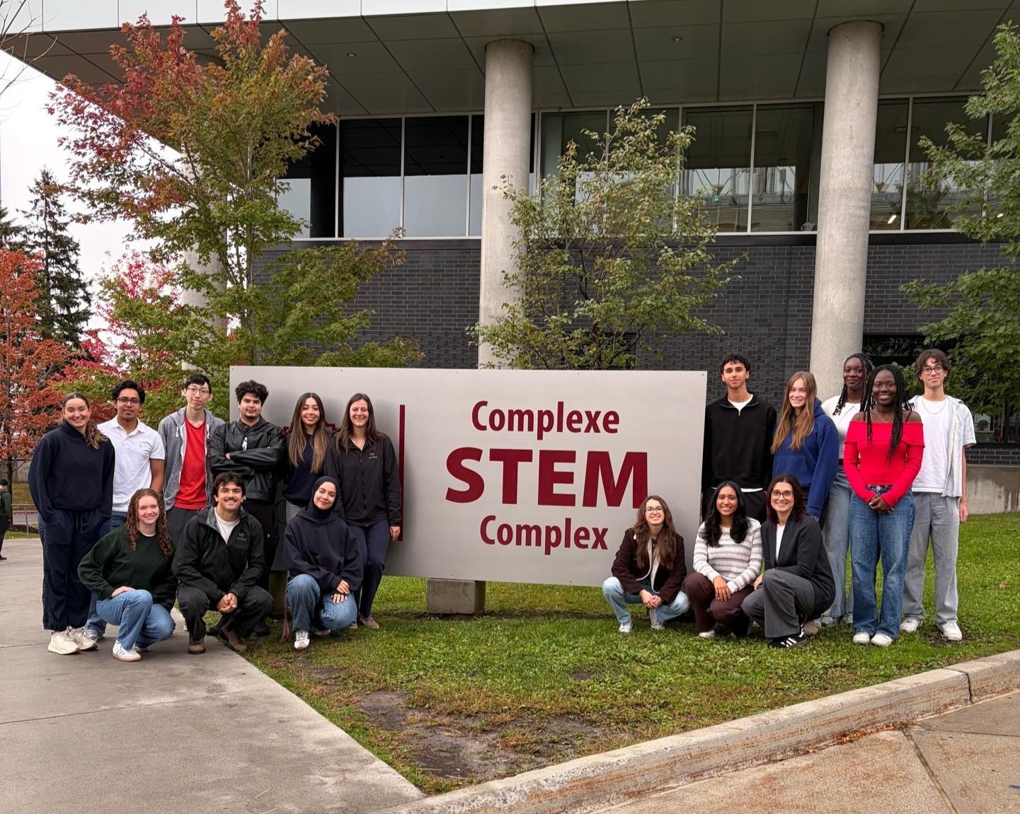 Student mentors standing in front of the STEM complex.