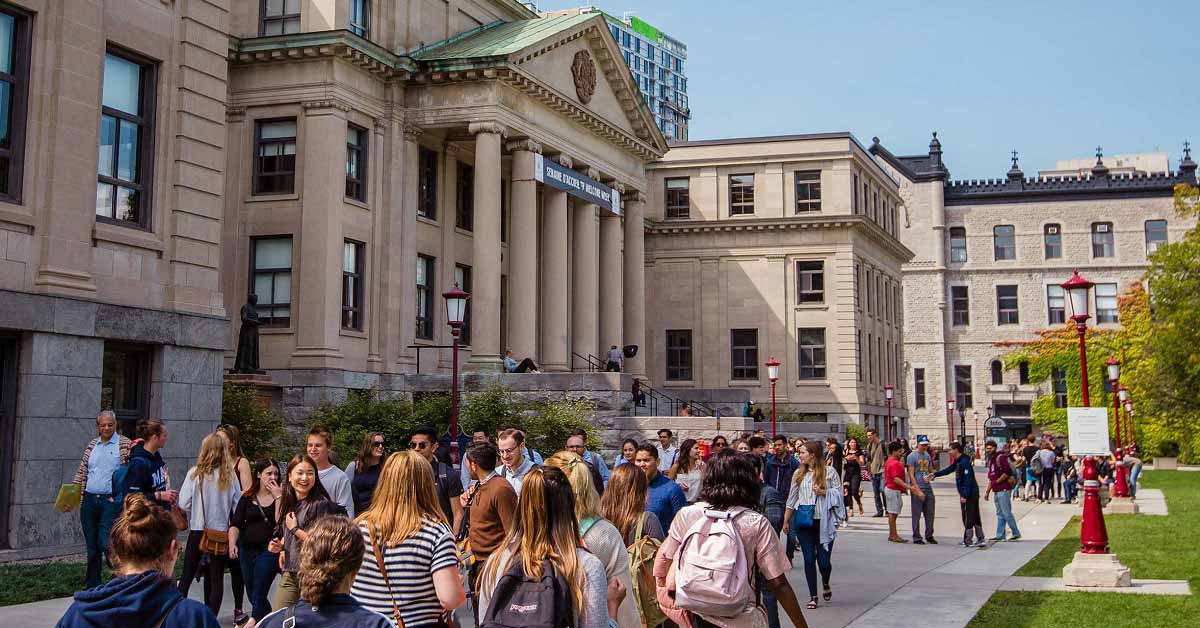 People walking in front of Tabaret Hall 