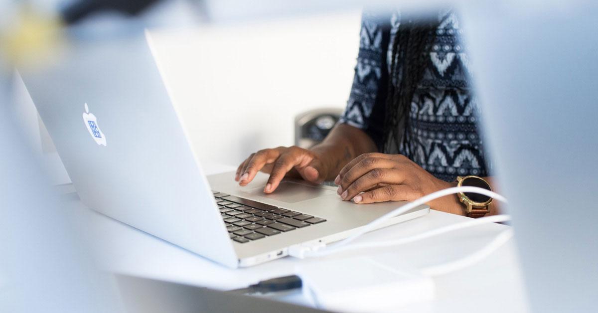 Person typing on laptop