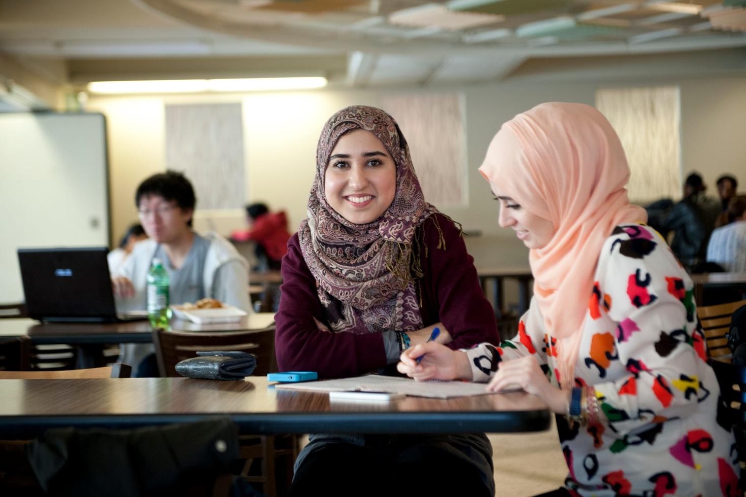 Smiling students working