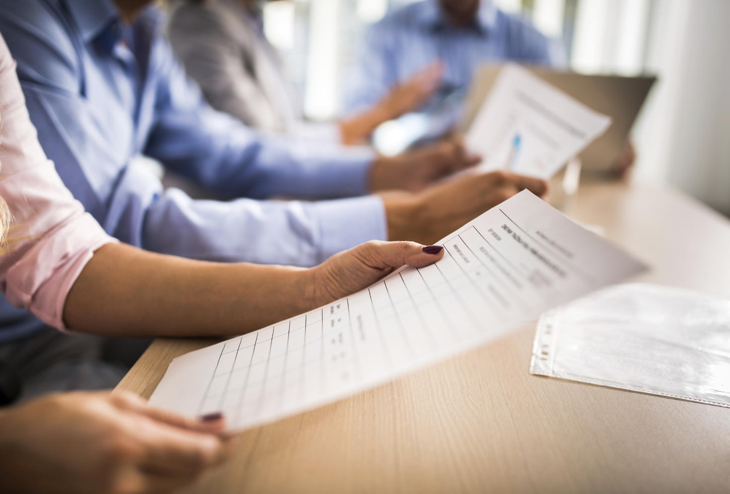 Students reviewing papers