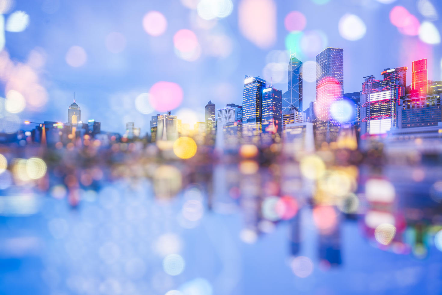 City skyline at night with blurred lights.