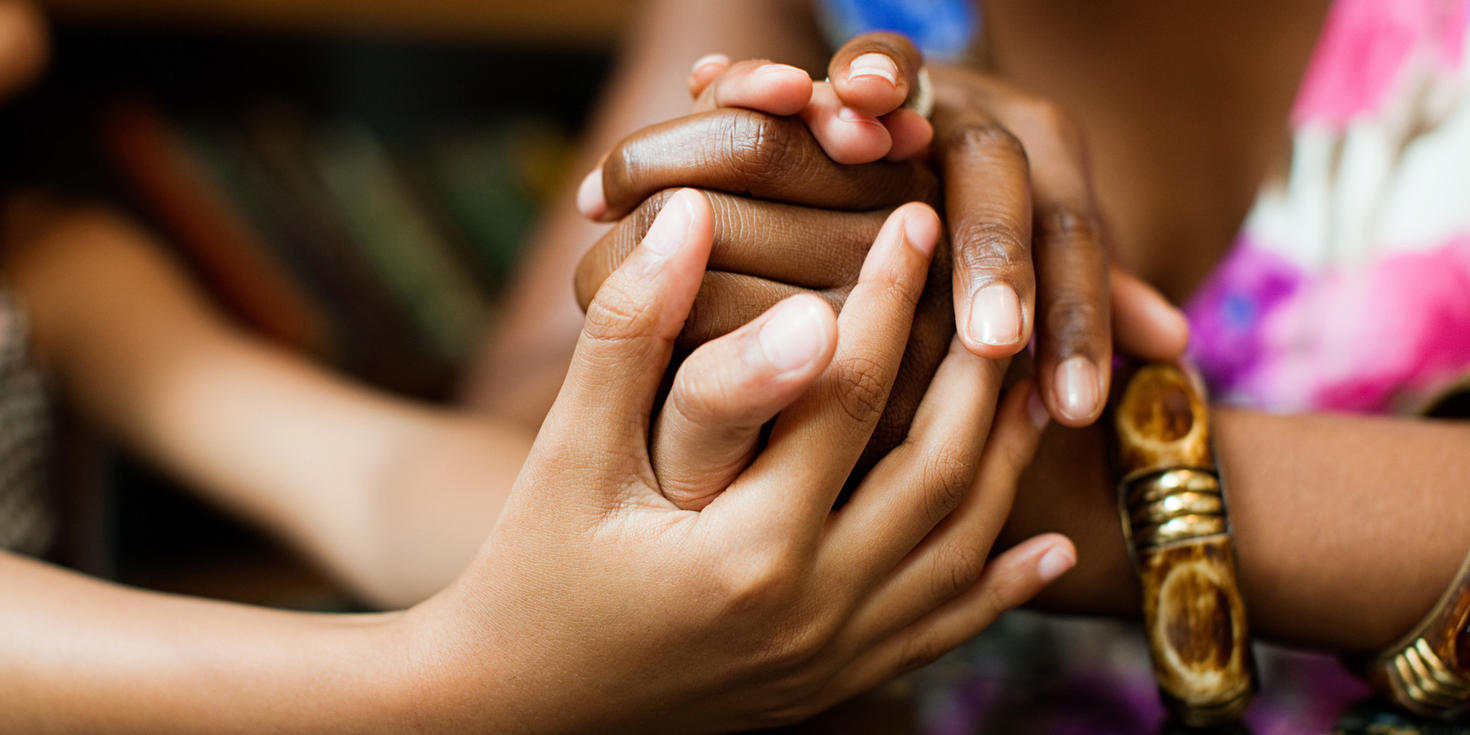 Two people holding hands