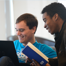 two students working smiling