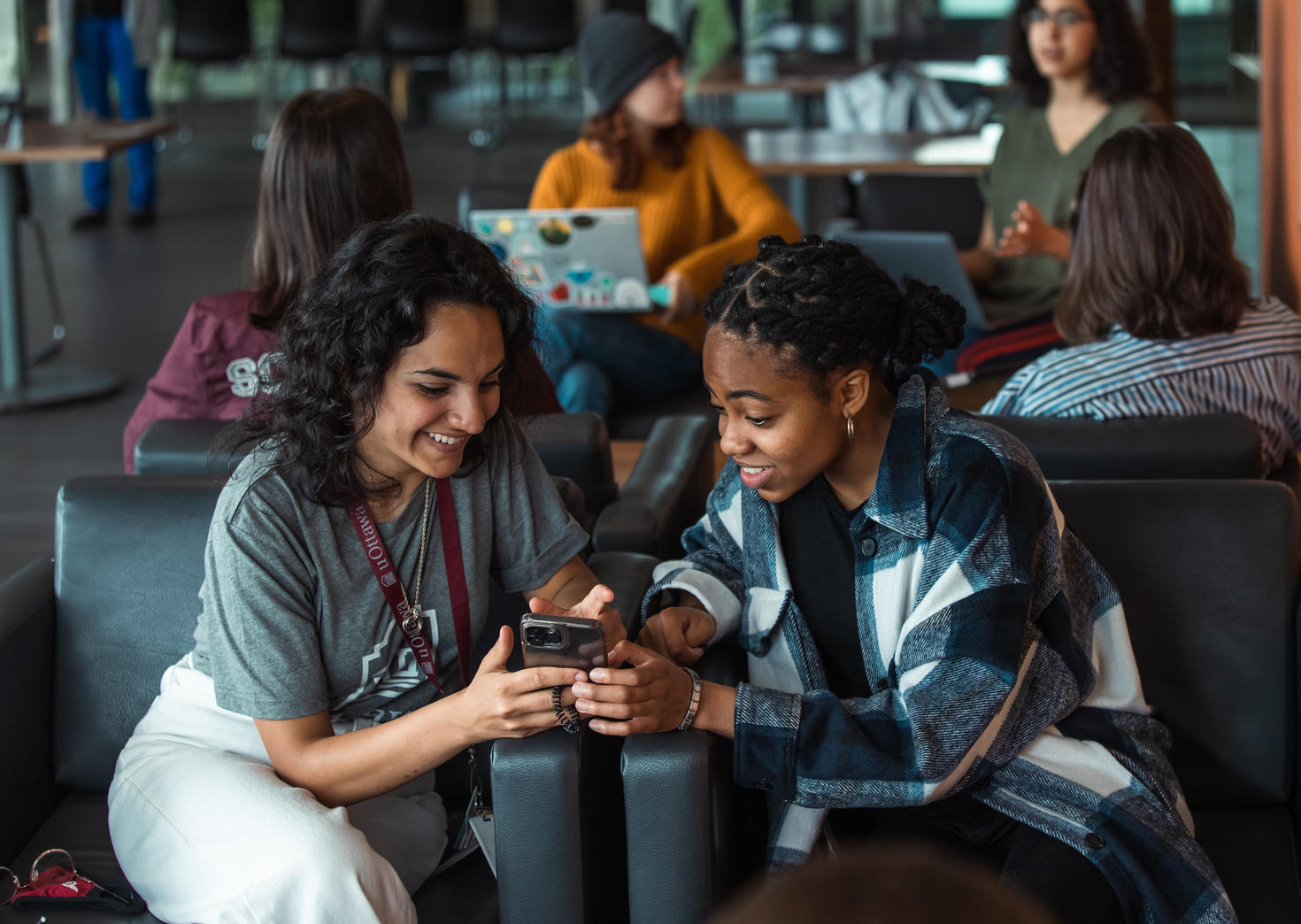 Students looking at smart phone