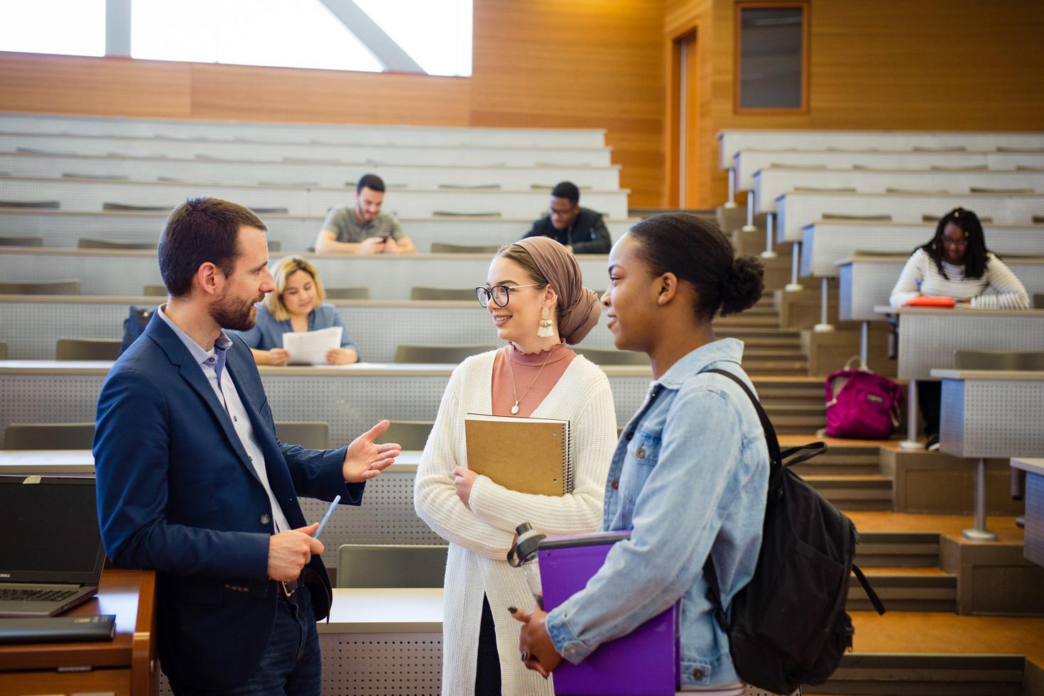 A professor talking to two students