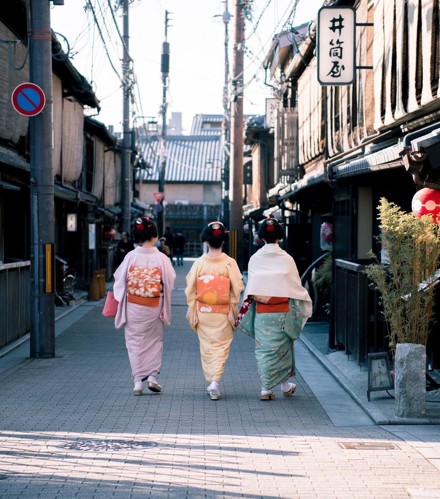 Geisha walking down street