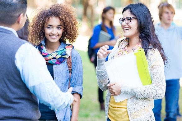 Students talking to a professor