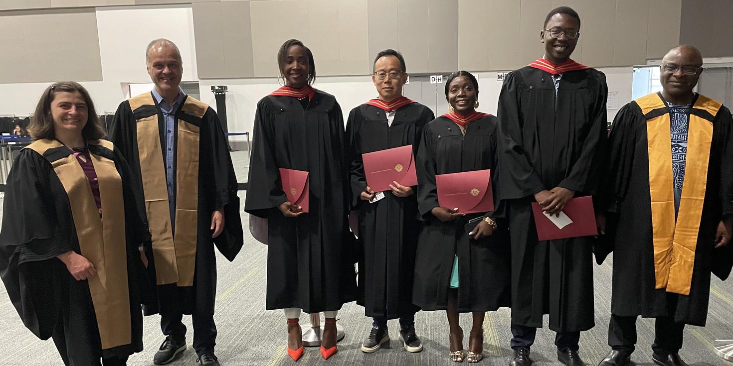 Economics PhD graduates and professors
