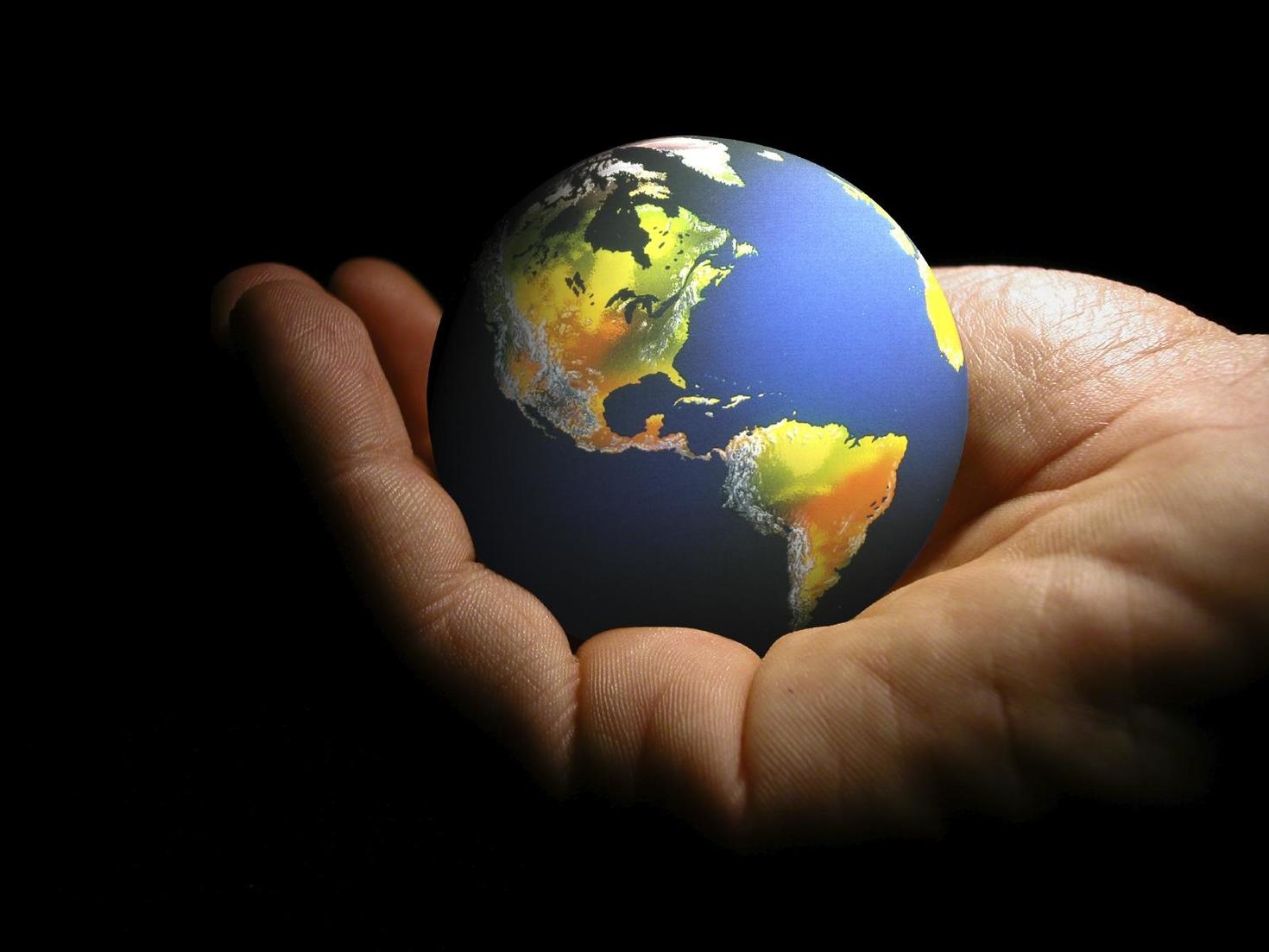 hand holds globe