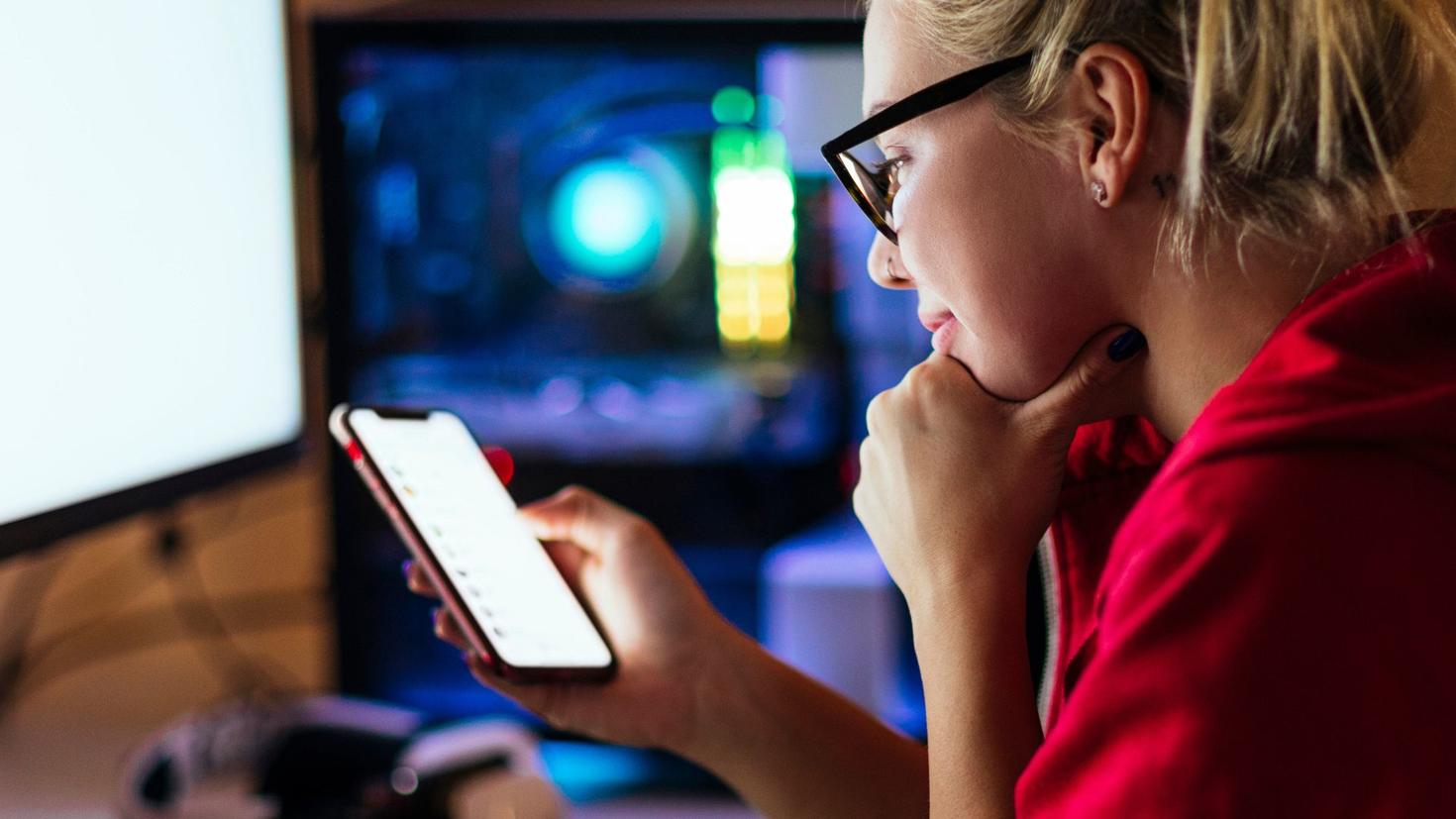 Master's student looking at her smart phone