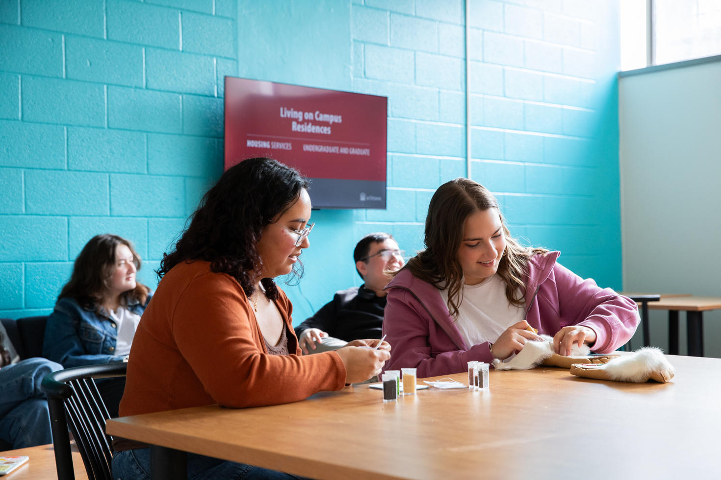 Students sitting at a table in the Living and Learning Community
