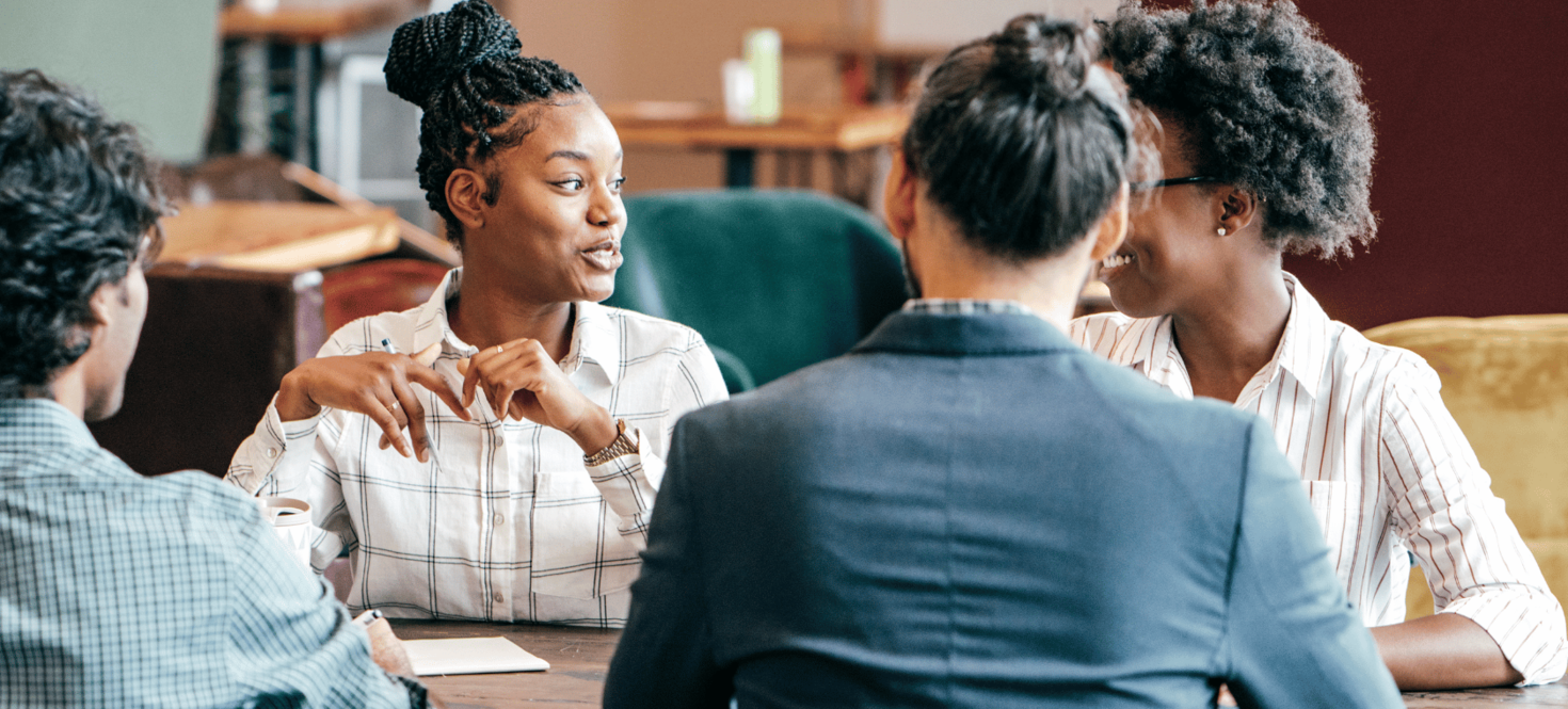 Young adults discussing at a table