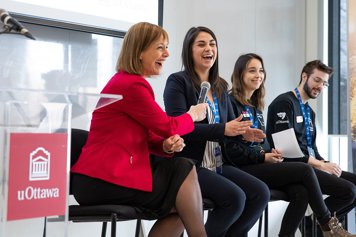 Woman speaking with students in a panel discussion