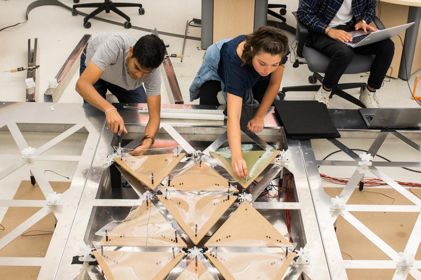 student working on project in classroom