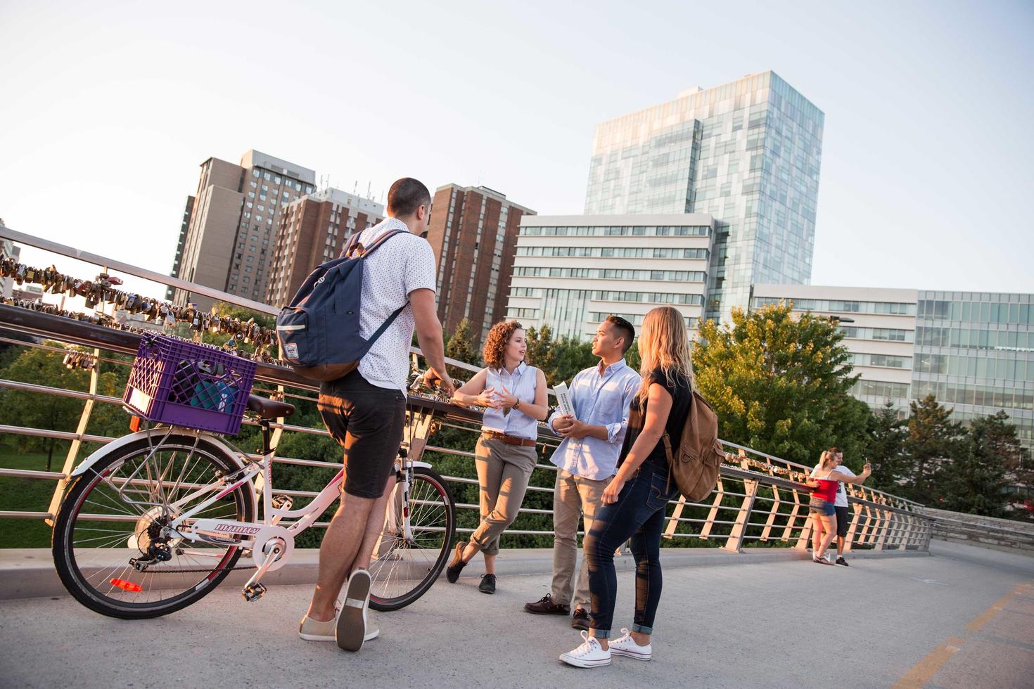 Students on a bridge over the Canal Rideau