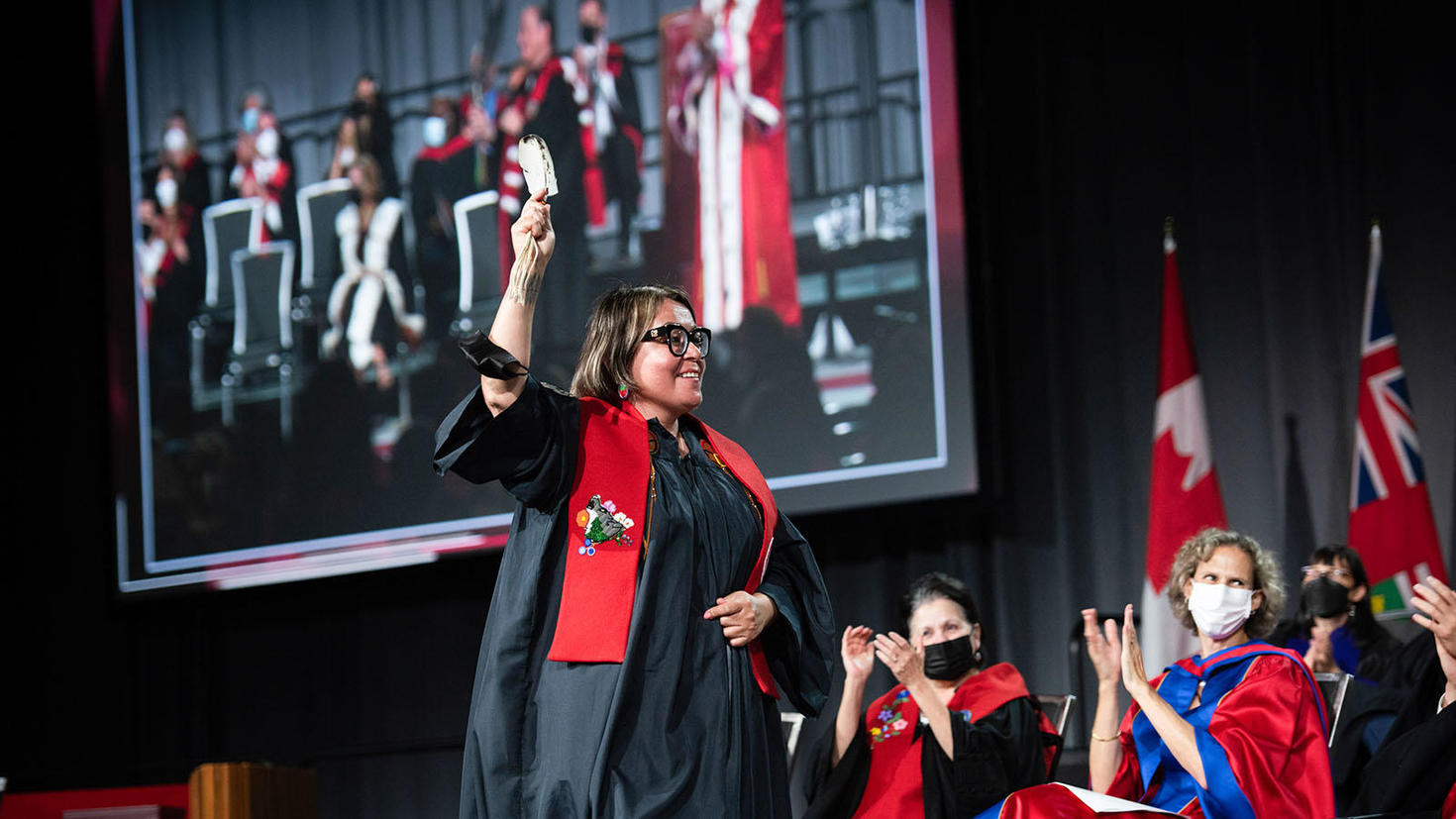 Student receiving diploma at convocation