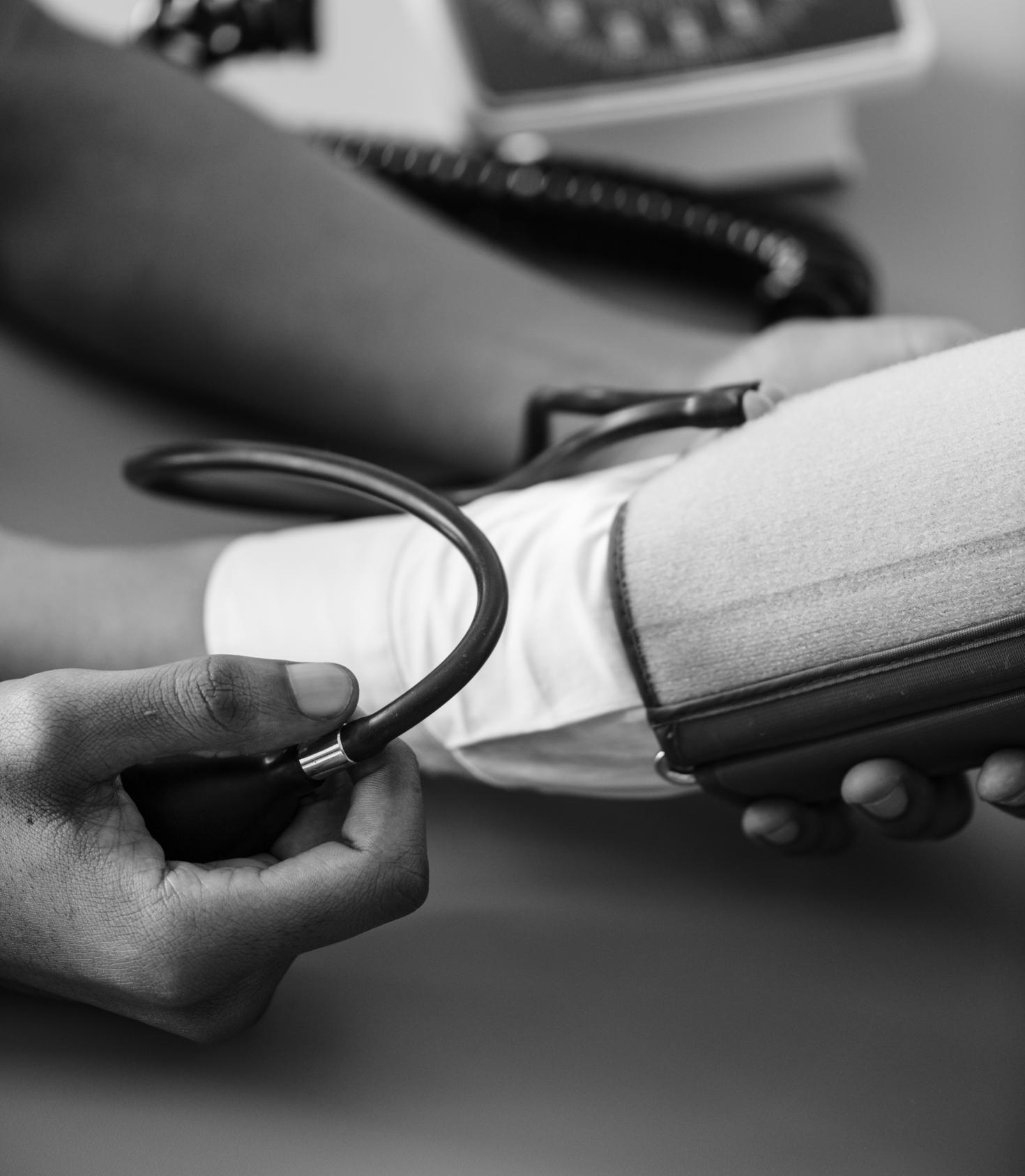Nurse taking a patients blood pressure