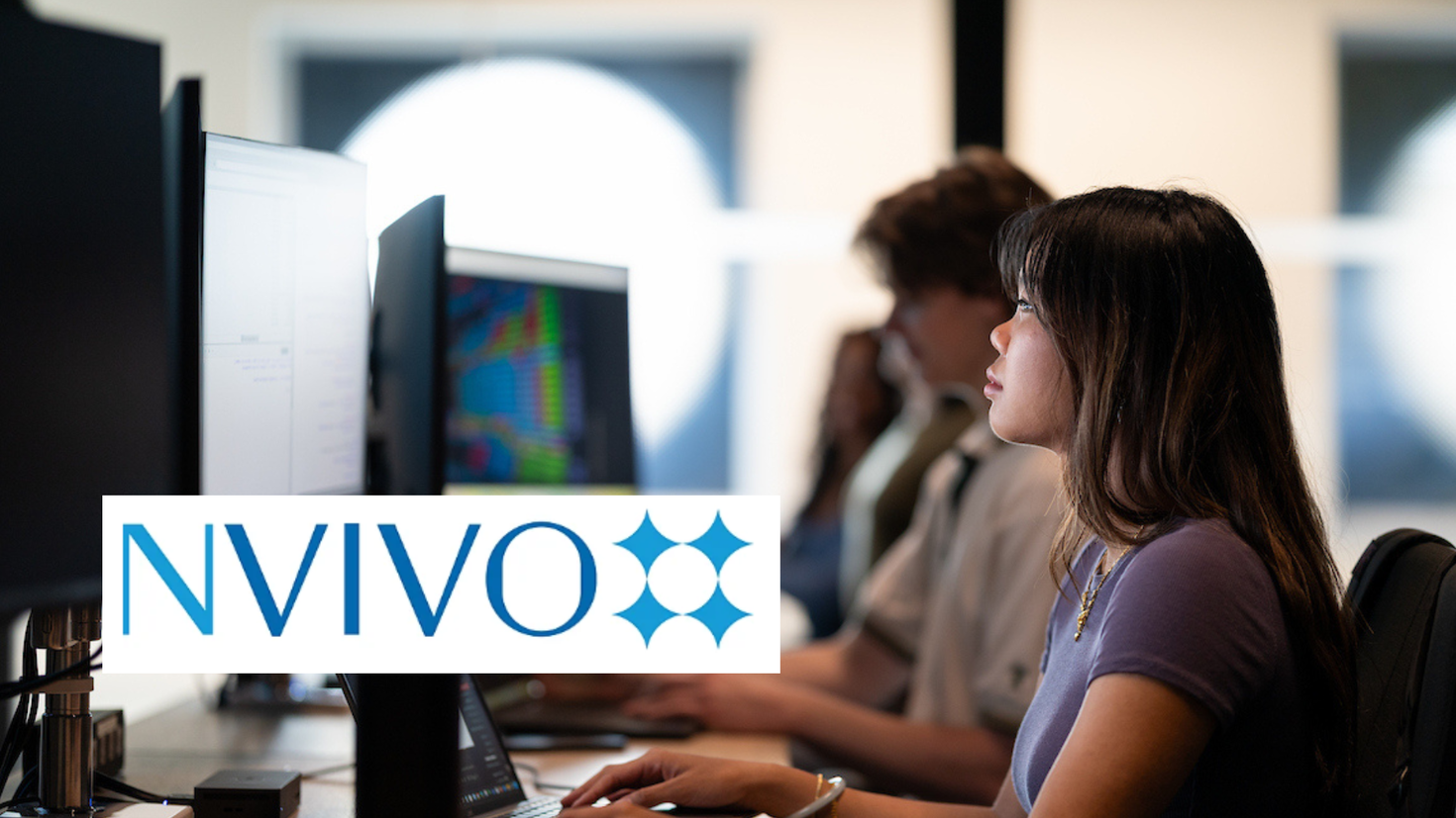 Students using Laptops with Nvivo Logo