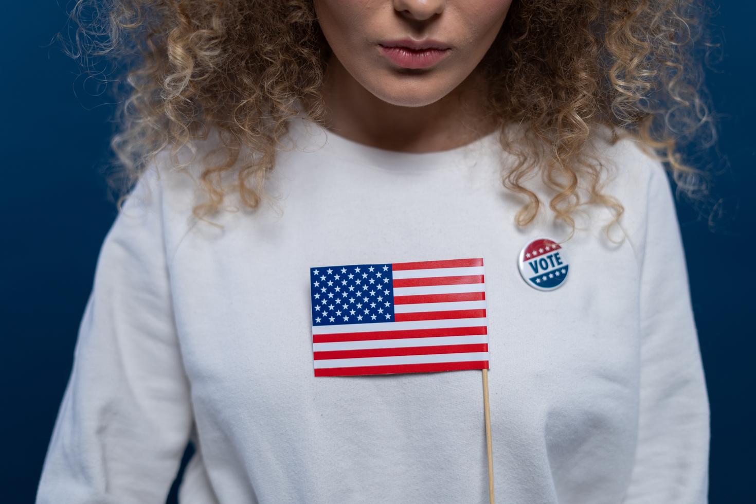 Young person wearing shirt with U.S. flag on it