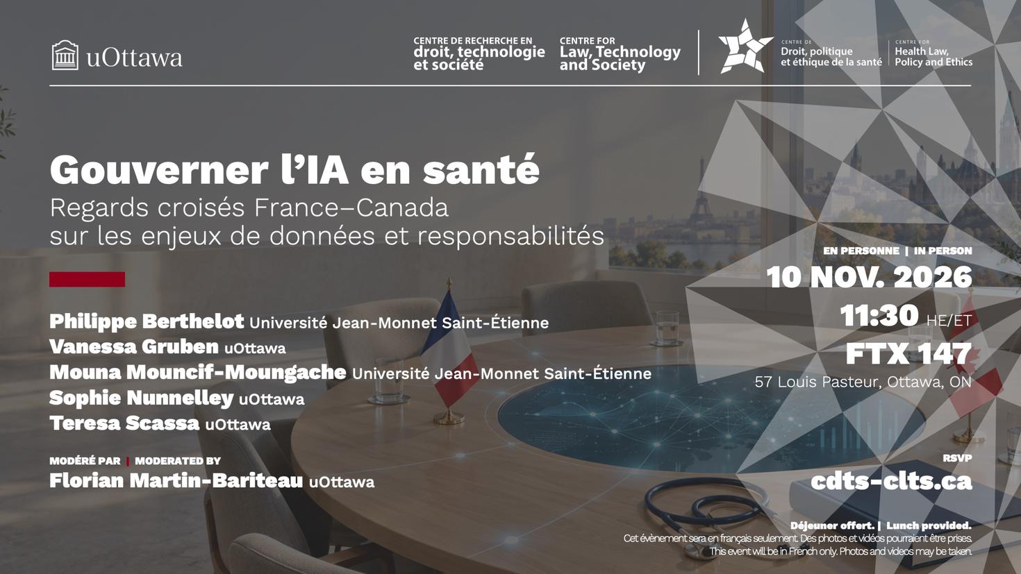 Une table ronde entourée de chaises, sur laquelle est posé les drapeaux de la France et du Canada.