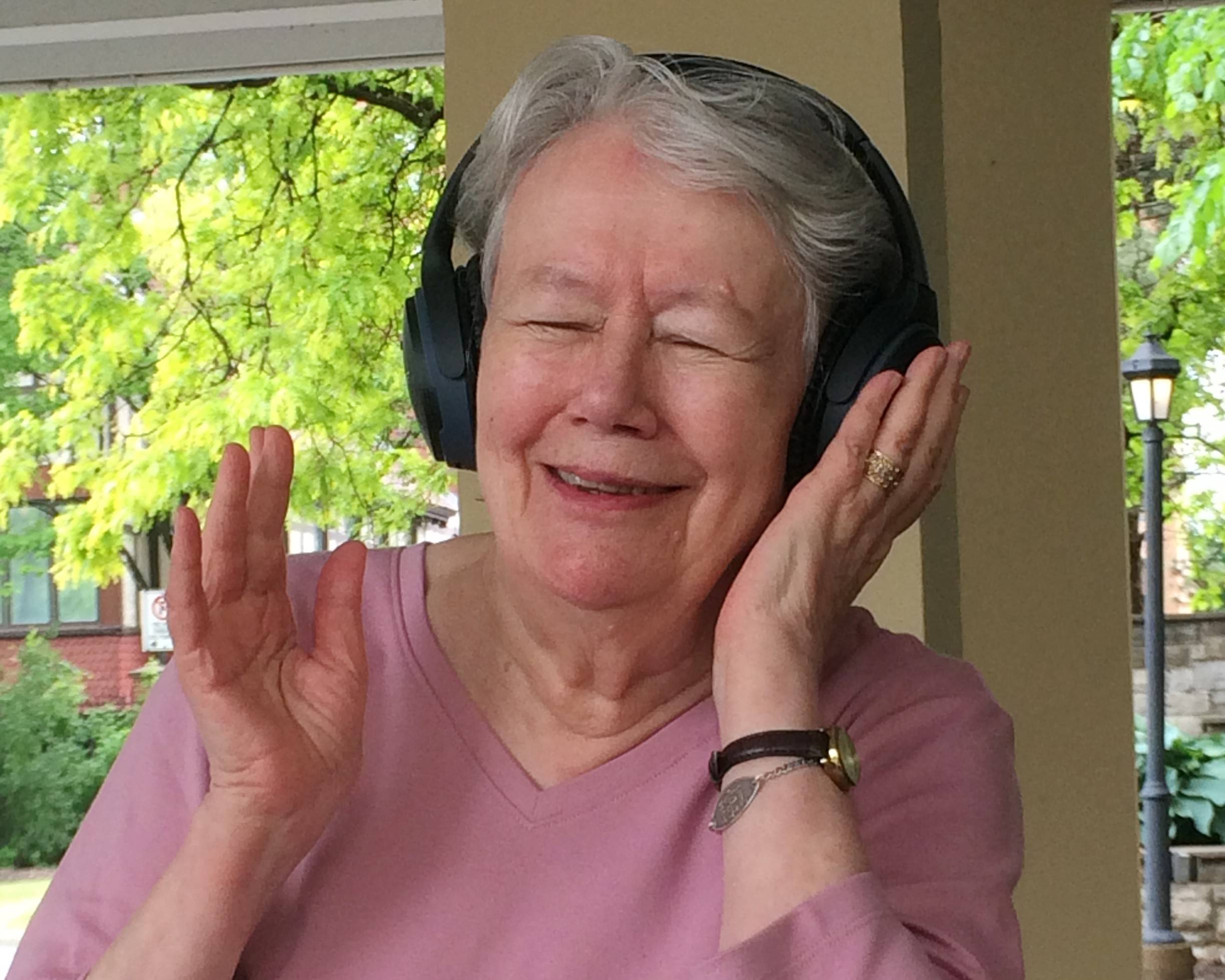 Lady smiling with headphones