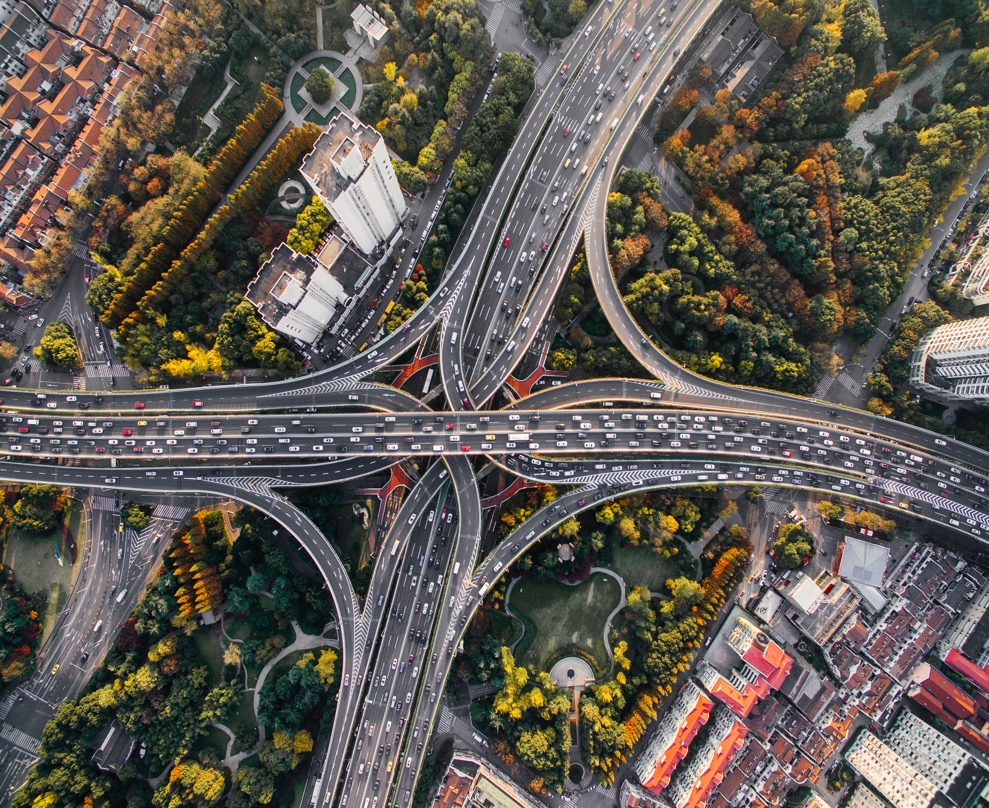 A bird's eye view of a busy highway in a city