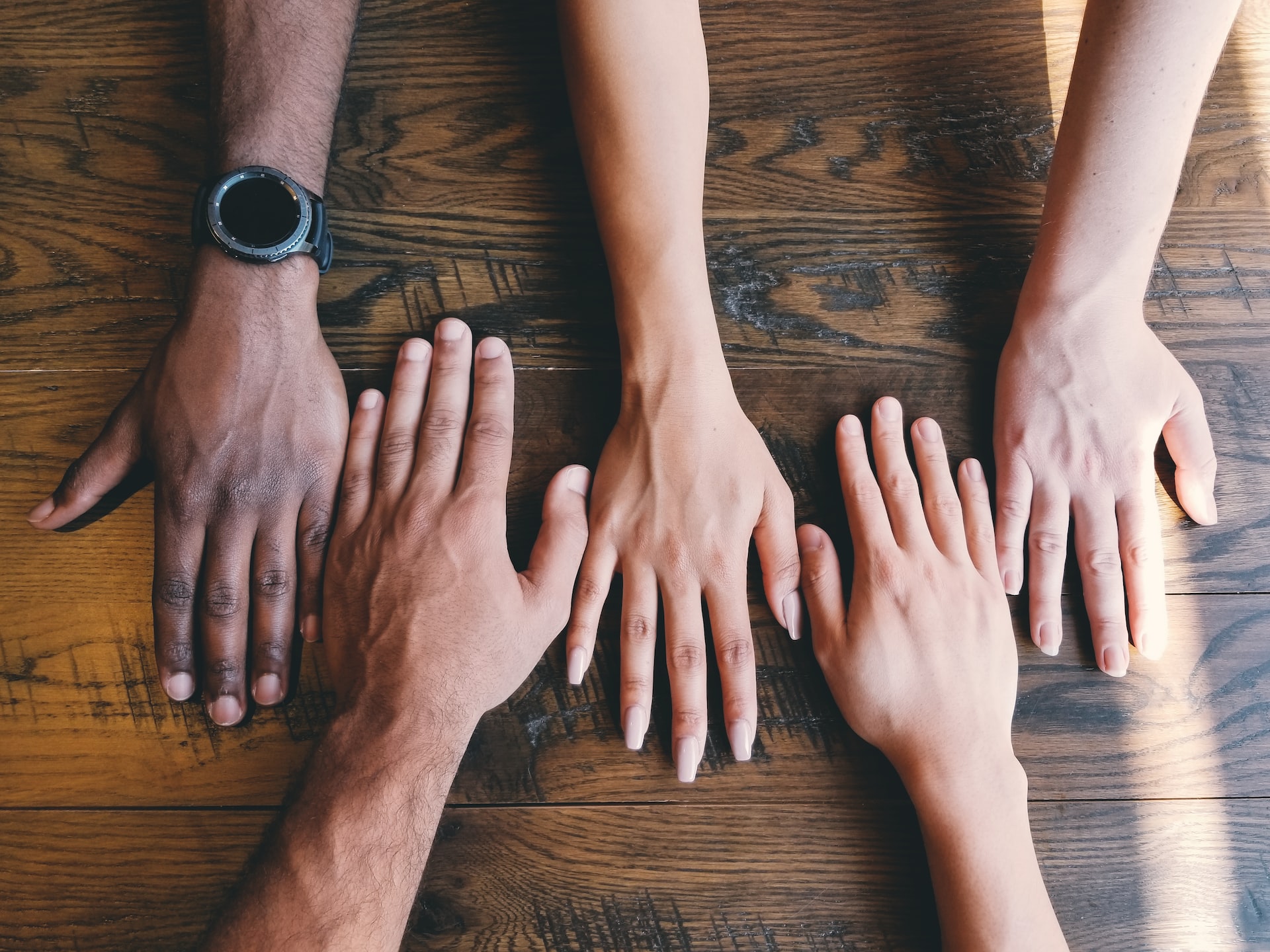 Different race palms on a wooden table