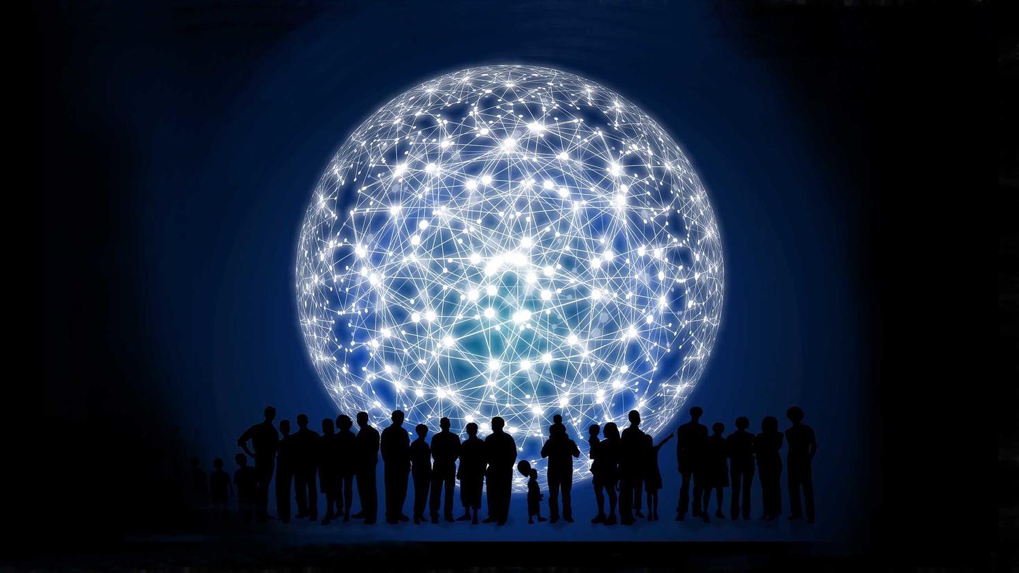 People posting in front of a giant circle of light