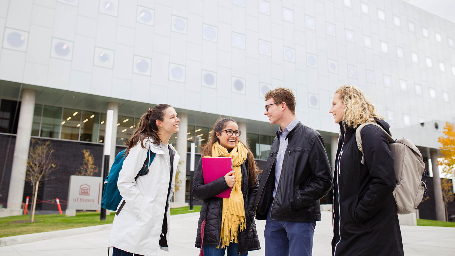 Students having a discussion in front of the Stem building