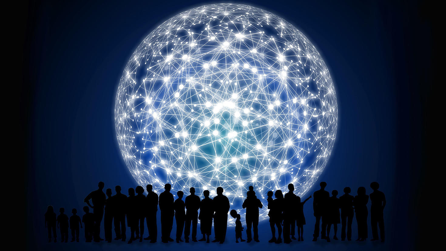 Silhouette of a group of people in front of a big light sphere