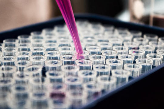 Liquid being poured in flasks