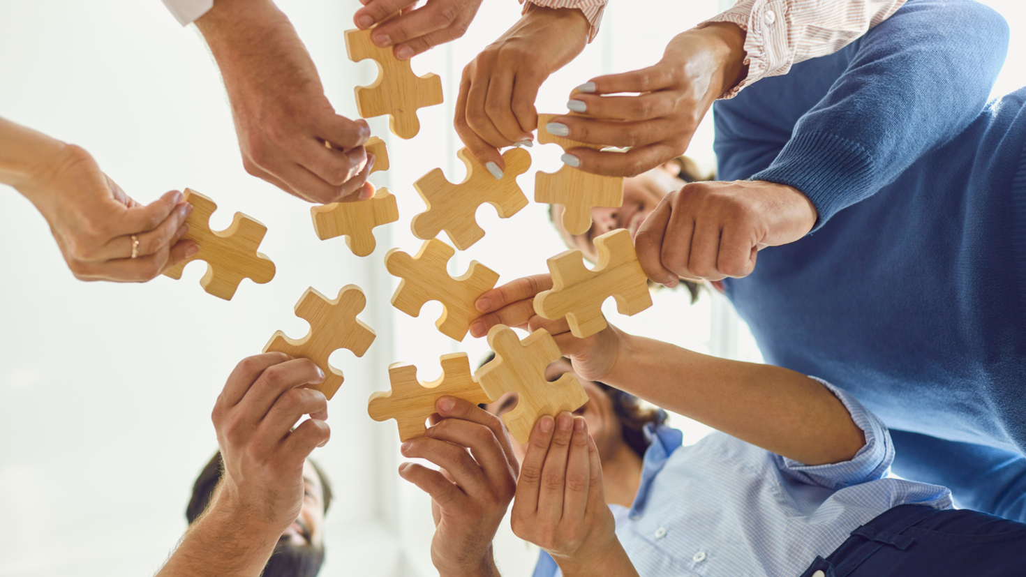 hands holding puzzle pieces