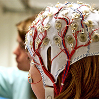 Student wearing electrodes on a head cap.