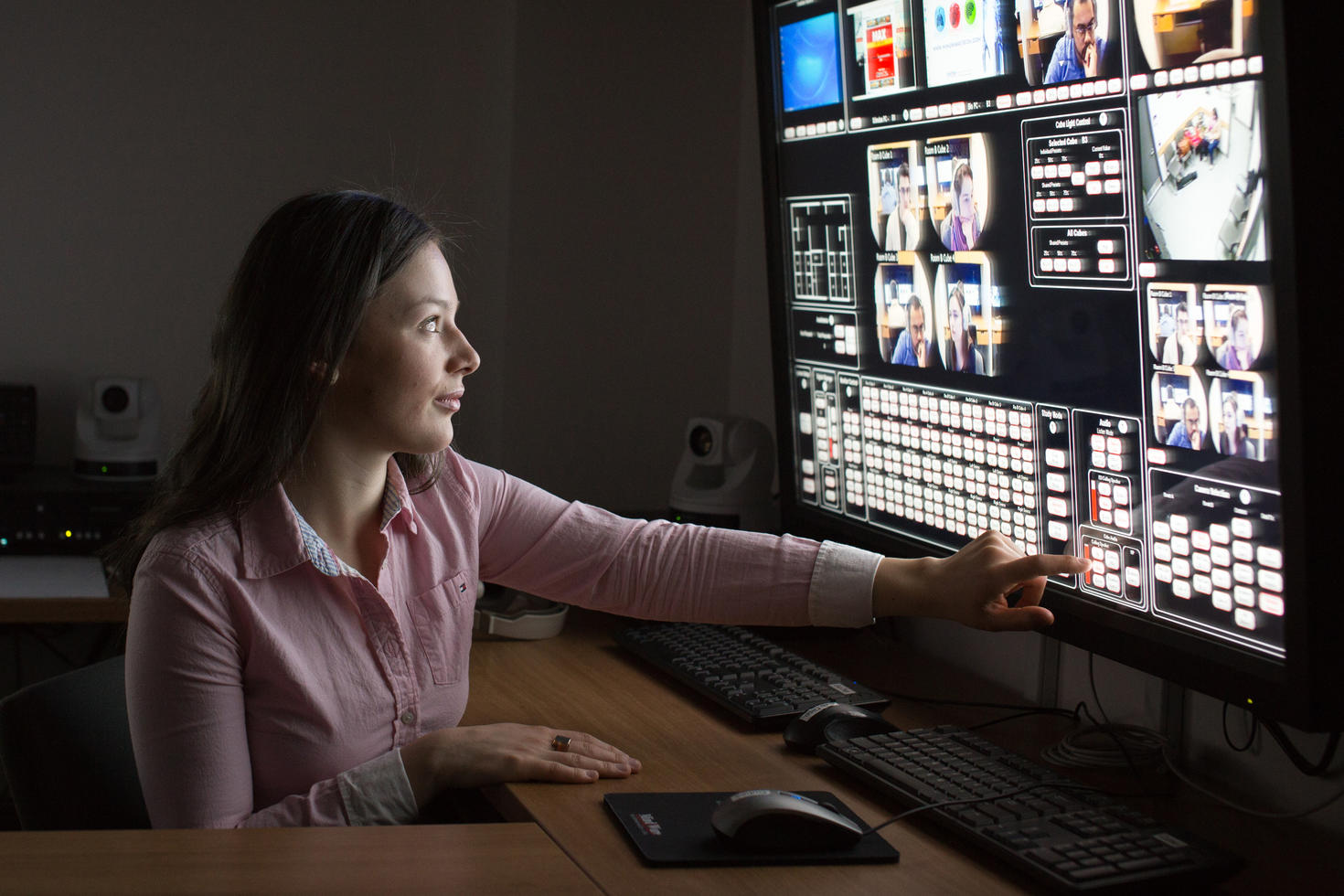 Woman working in the INSPIRE Lab control room