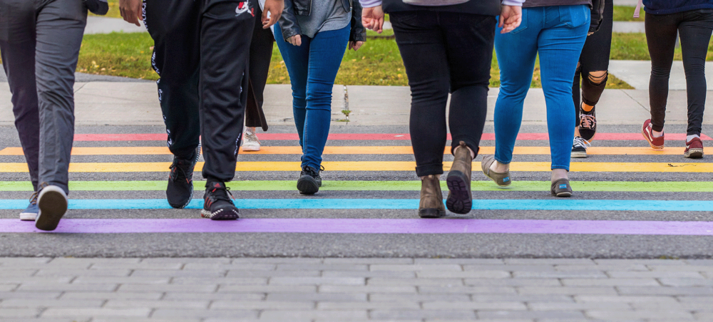 People crossing uOttawa rainbow sidewalk