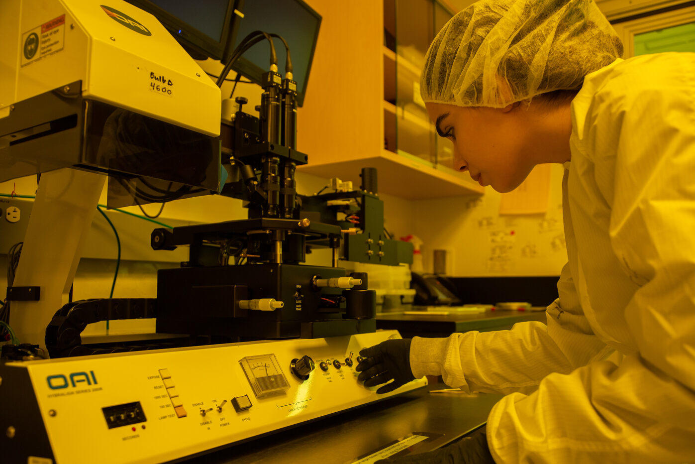 Lab worker handling tech equipment
