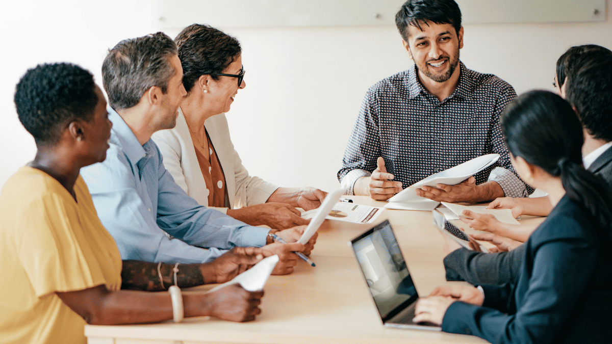 Group of researchers working together in a boardroom