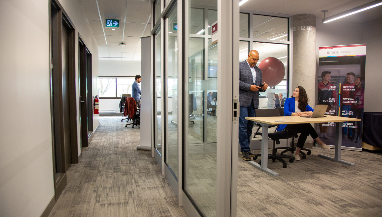 Telfer's new modern office space with glass-walled rooms, located in the new Kanata North campus location.