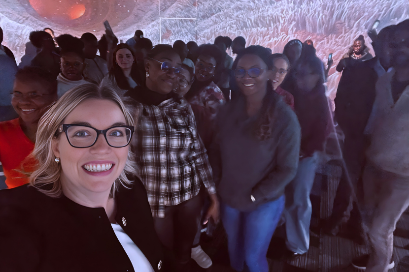 Professor Megan Cotnam-Kappel with university students enjoying the Immersive Cylinder at INNOVA.