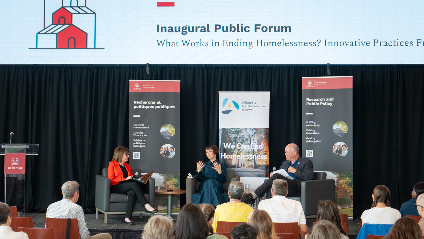 Susan Farrell, Lígia Teixeira and Tim Aubry during a panel discussion.