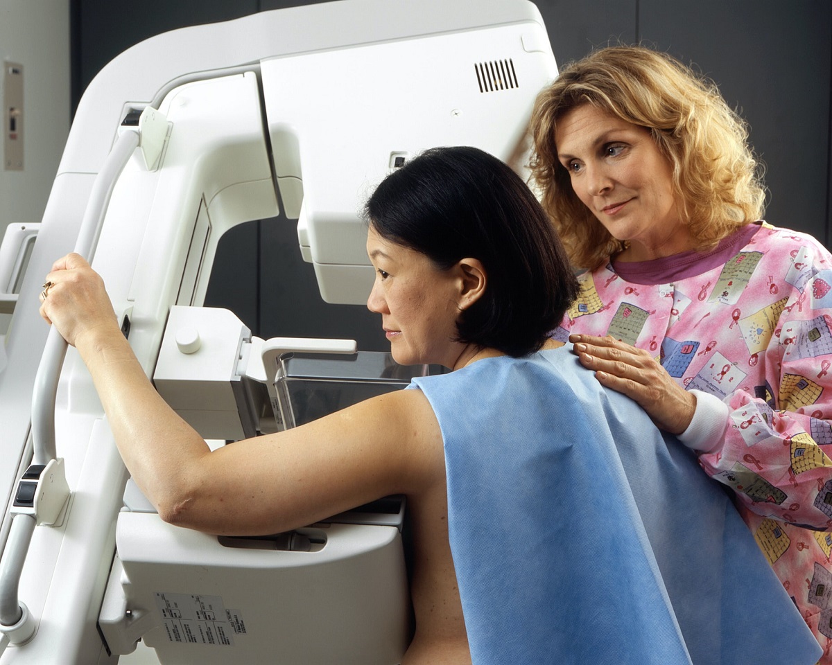 Asian woman undergoing mammogram